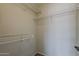 A neutral walk-in closet featuring wire shelving, perfect for storage solutions at 1744 W Brookwood Ct, Phoenix, AZ 85045