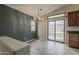 Dining area featuring a chandelier, sliding glass door, and views of the backyard at 1744 W Brookwood Ct, Phoenix, AZ 85045
