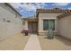 Inviting home featuring a covered entrance, desert landscaping, and a paved walkway at 1744 W Brookwood Ct, Phoenix, AZ 85045