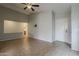 Spacious living area showcasing neutral walls, tile floors, and a bright white front door at 1744 W Brookwood Ct, Phoenix, AZ 85045
