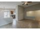 Bright, open living space featuring tiled flooring and direct access to the kitchen at 1744 W Brookwood Ct, Phoenix, AZ 85045