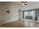 Well-lit living room featuring tile floors, neutral paint, and a large window at 1744 W Brookwood Ct, Phoenix, AZ 85045