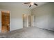 A peaceful primary bedroom featuring neutral paint, carpet, and direct access to a private bathroom at 1744 W Brookwood Ct, Phoenix, AZ 85045