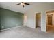 A comfortable primary bedroom features neutral color palette, carpeting, and closet at 1744 W Brookwood Ct, Phoenix, AZ 85045