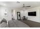 Bright and airy bedroom with neutral tones, comfortable carpeting, and a ceiling fan at 18550 N 94Th St, Scottsdale, AZ 85255