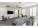 Bright and airy primary bedroom featuring a ceiling fan, carpet, and natural light at 18550 N 94Th St, Scottsdale, AZ 85255
