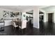 Dining area with modern lighting fixtures next to the kitchen and stairs at 18550 N 94Th St, Scottsdale, AZ 85255