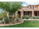 Charming single-Gathering home with a well-manicured lawn, desert landscaping, and inviting front porch at 18550 N 94Th St, Scottsdale, AZ 85255
