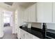 Upstairs hallway area features built-in cabinets and a black countertop at 18550 N 94Th St, Scottsdale, AZ 85255