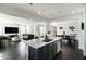 Open-concept kitchen with island flows into living area; features stainless appliances at 18550 N 94Th St, Scottsdale, AZ 85255