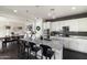 Well-appointed kitchen with a large center island, tile backsplash, and stainless steel appliances at 18550 N 94Th St, Scottsdale, AZ 85255