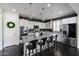 Modern kitchen features a large center island, stainless steel appliances, and pendant lighting at 18550 N 94Th St, Scottsdale, AZ 85255