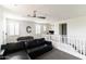 Upstairs common area features a foosball table, comfortable sofa, desk, and plenty of natural light at 18550 N 94Th St, Scottsdale, AZ 85255