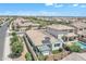 Expansive aerial view reveals a home with solar panels and a private, landscaped backyard at 1876 S Huish Dr, Gilbert, AZ 85295
