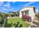 Landscaped backyard offers low maintenance artificial turf and a covered pergola dining area at 1876 S Huish Dr, Gilbert, AZ 85295