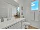 Bright bathroom featuring a white vanity, modern fixtures, and a window view at 1876 S Huish Dr, Gilbert, AZ 85295