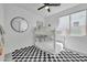 Charming bunk bedroom with a round mirror, bookshelf, and stylish carpet at 1876 S Huish Dr, Gilbert, AZ 85295