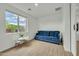 Versatile bonus room with sofa, table and chairs, with ample natural light at 1876 S Huish Dr, Gilbert, AZ 85295