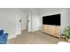 Bonus room featuring decorative barn doors, a TV, and modern decor at 1876 S Huish Dr, Gilbert, AZ 85295