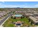Aerial image showcasing community pool with lounge areas and views of the mountains at 1876 S Huish Dr, Gilbert, AZ 85295
