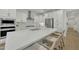 Updated kitchen featuring stainless appliances, a large island with seating, and stylish white cabinetry at 1876 S Huish Dr, Gilbert, AZ 85295