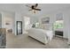 Bright main bedroom with ensuite bathroom, large mirror, and neutral decor at 1876 S Huish Dr, Gilbert, AZ 85295