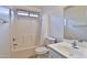 Bathroom with a shower-tub combo, single sink vanity, and neutral finishes at 19002 N Toledo Ave, Maricopa, AZ 85138