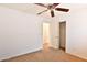 Bright bedroom with a ceiling fan and spacious layout, offering a relaxing retreat at 19002 N Toledo Ave, Maricopa, AZ 85138
