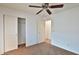 Bedroom with closet and ceiling fan, offering a comfortable and functional space at 19002 N Toledo Ave, Maricopa, AZ 85138