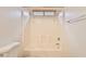 Clean white shower and tub combination featuring a window and modern fixtures for a bright and functional space at 19002 N Toledo Ave, Maricopa, AZ 85138
