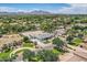 Community home featuring a large gravel yard and lush green landscaping set against a backdrop of mountains at 19935 E Via Del Palo --, Queen Creek, AZ 85142