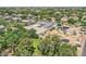 Community home with gravel yard and lush landscaping, set amidst mature trees and neighboring residences at 19935 E Via Del Palo --, Queen Creek, AZ 85142