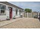 The home features a secure fenced backyard with an access gate and decorative landscaping at 19935 E Via Del Palo --, Queen Creek, AZ 85142
