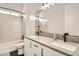 Well-lit bathroom featuring a double sink vanity with black fixtures, white cabinets, and a tub/shower combination for versatile use at 19935 E Via Del Palo --, Queen Creek, AZ 85142