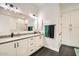 Stylish bathroom with a double sink vanity, white cabinets, modern black fixtures, and coordinated gray countertops and flooring at 19935 E Via Del Palo --, Queen Creek, AZ 85142
