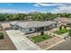 Expansive single story home featuring desert landscaping, a concrete driveway, and a gray tile roof at 19935 E Via Del Palo --, Queen Creek, AZ 85142