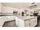 Beautiful kitchen with granite countertops, white cabinetry, a large island, and stainless steel appliances at 19935 E Via Del Palo --, Queen Creek, AZ 85142