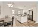 This kitchen features modern appliances, an island with storage, and a dining table and chairs at 19935 E Via Del Palo --, Queen Creek, AZ 85142