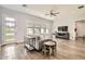 A Gathering room features sleek tile floors, ample light, a ceiling fan, and neutral decor at 19935 E Via Del Palo --, Queen Creek, AZ 85142