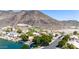 Picturesque neighborhood with lakefront properties, lush landscaping, and mountain views, offering a serene residential setting at 20410 N 51St Dr, Glendale, AZ 85308