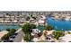 Breathtaking aerial view of a waterfront neighborhood, showcasing beautiful homes with private docks and lush landscaping at 20410 N 51St Dr, Glendale, AZ 85308