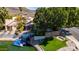 Waterfront home with boat dock, lush lawn and mature trees, offering serene lakeside living with direct water access at 20410 N 51St Dr, Glendale, AZ 85308