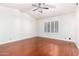 Bright bedroom with vaulted ceilings, plantation shutters, and hardwood flooring at 20410 N 51St Dr, Glendale, AZ 85308