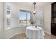 Charming breakfast nook with a lake view, featuring large windows and stylish lighting at 20410 N 51St Dr, Glendale, AZ 85308