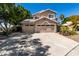 Charming two-story home with a three-car garage, well-manicured landscaping and a spacious driveway for easy parking at 20410 N 51St Dr, Glendale, AZ 85308