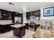 Stylish kitchen featuring granite countertops, stainless steel appliances, and dark cabinetry at 20410 N 51St Dr, Glendale, AZ 85308