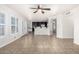 Open-concept living room featuring tile flooring, bar seating, and views of the kitchen and breakfast nook at 20410 N 51St Dr, Glendale, AZ 85308