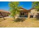 Private backyard featuring a patio area and mature landscaping at 22191 W Tonto St, Buckeye, AZ 85326