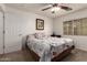 Comfortable bedroom features a large window and soft carpeting at 22191 W Tonto St, Buckeye, AZ 85326