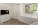 Functional bedroom features closet space, window, and white dresser at 22191 W Tonto St, Buckeye, AZ 85326